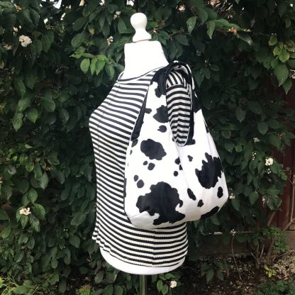 Large Hobo Round handbag in Cow Print Faux Fur