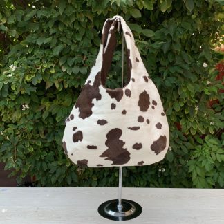 Hobo Round handbag in Brown Cow Print Faux Fur